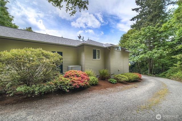 2660 NW Canal View Way, Poulsbo, WA 98370 - view of property exterior featuring central air condition unit and driveway