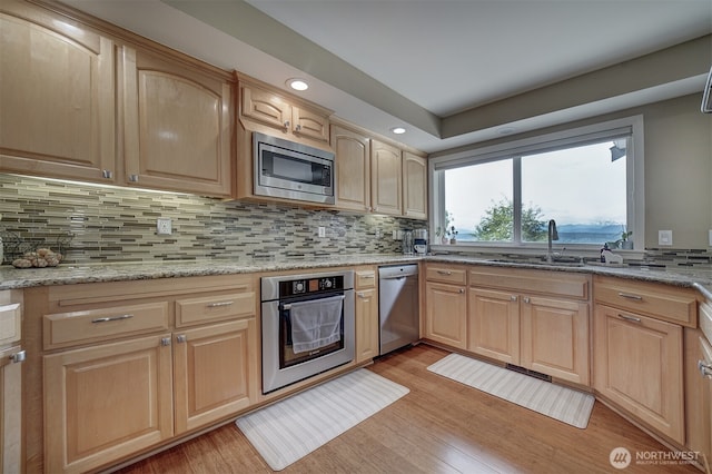 2660 NW Canal View Way, Poulsbo, WA 98370 - kitchen with stainless steel appliances, a sink, light brown cabinets, decorative backsplash, and recessed lighting