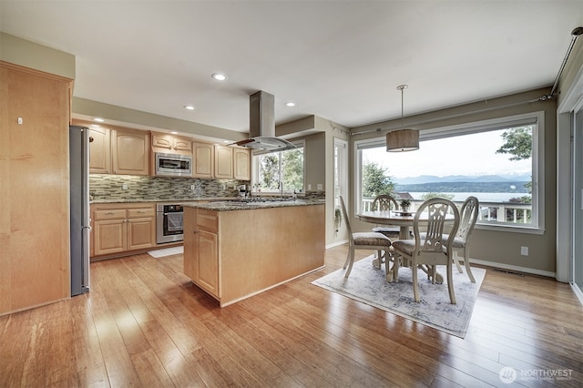 2660 NW Canal View Way, Poulsbo, WA 98370 - kitchen featuring light brown cabinets, stainless steel appliances, island exhaust hood, light wood finished floors, and recessed lighting