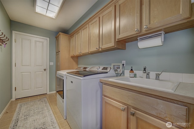 2660 NW Canal View Way, Poulsbo, WA 98370 - laundry room with separate washer and dryer, cabinet space, light tile patterned flooring, and baseboards