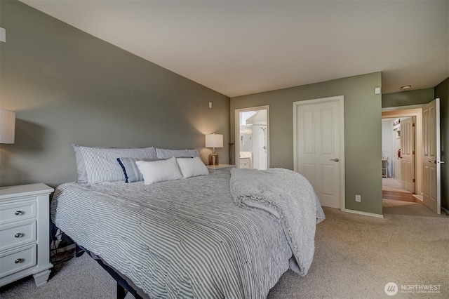 2660 NW Canal View Way, Poulsbo, WA 98370 - bedroom with light carpet, ensuite bathroom, and baseboards