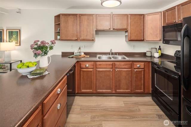 700 Front St S Unit D106, Issaquah, WA 98027 - kitchen featuring a sink, black appliances, dark countertops, light wood finished floors, and open shelves