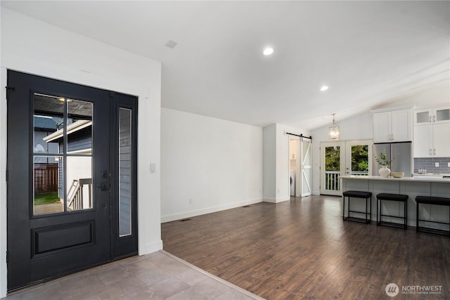 1420 Mitchell Rd, Lake Stevens, WA 98258 - foyer with a barn door, baseboards, lofted ceiling, recessed lighting, and dark wood-style flooring