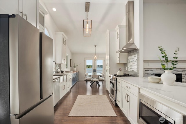 1420 Mitchell Rd, Lake Stevens, WA 98258 - kitchen with appliances with stainless steel finishes, wall chimney range hood, white cabinetry, glass insert cabinets, and tasteful backsplash