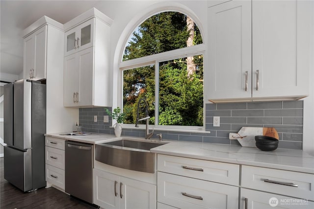 1420 Mitchell Rd, Lake Stevens, WA 98258 - kitchen with stainless steel appliances, a sink, light stone countertops, backsplash, and healthy amount of natural light