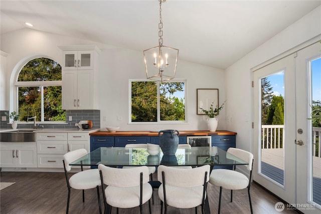 1420 Mitchell Rd, Lake Stevens, WA 98258 - dining room with vaulted ceiling, dark wood-type flooring, and a chandelier