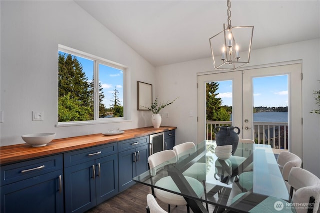 1420 Mitchell Rd, Lake Stevens, WA 98258 - dining space featuring a chandelier, healthy amount of natural light, dark wood-style flooring, lofted ceiling, and french doors