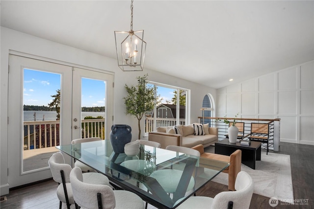 1420 Mitchell Rd, Lake Stevens, WA 98258 - dining space featuring french doors, dark wood-style floors, a chandelier, a decorative wall, and lofted ceiling