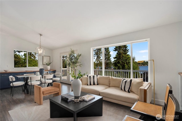 1420 Mitchell Rd, Lake Stevens, WA 98258 - living area featuring healthy amount of natural light, wood finished floors, a chandelier, and vaulted ceiling