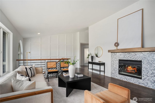 1420 Mitchell Rd, Lake Stevens, WA 98258 - living area featuring a tiled fireplace, a decorative wall, wood finished floors, and recessed lighting