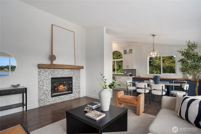 1420 Mitchell Rd, Lake Stevens, WA 98258 - living room with wood finished floors, a tile fireplace, lofted ceiling, and a chandelier