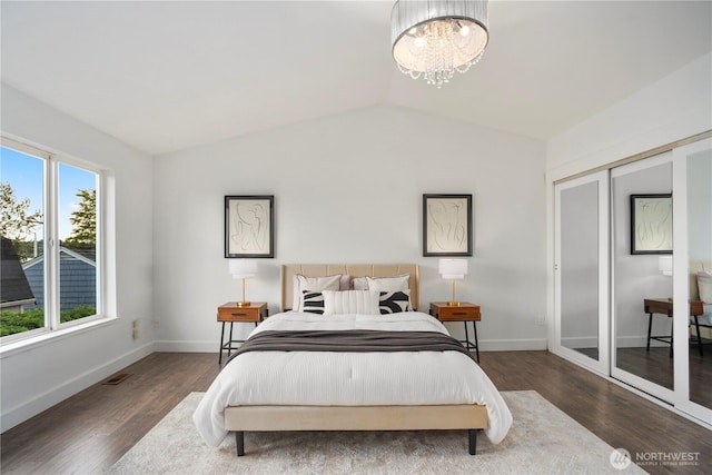 1420 Mitchell Rd, Lake Stevens, WA 98258 - bedroom featuring lofted ceiling, wood finished floors, a chandelier, and baseboards