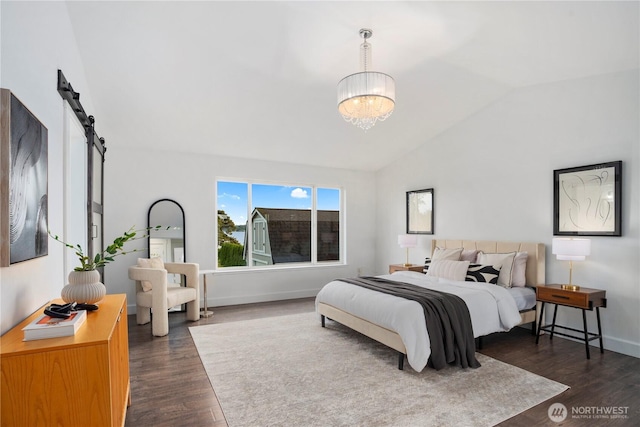 1420 Mitchell Rd, Lake Stevens, WA 98258 - bedroom featuring dark wood-style flooring, vaulted ceiling, a chandelier, baseboards, and a barn door