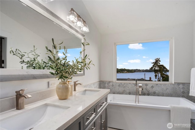 1420 Mitchell Rd, Lake Stevens, WA 98258 - full bath with vaulted ceiling, a freestanding tub, double vanity, and a water view