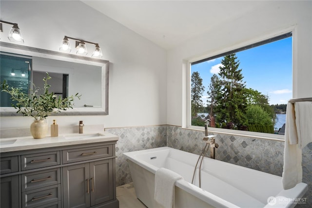 1420 Mitchell Rd, Lake Stevens, WA 98258 - full bath with double vanity, a freestanding tub, tile walls, and a wainscoted wall