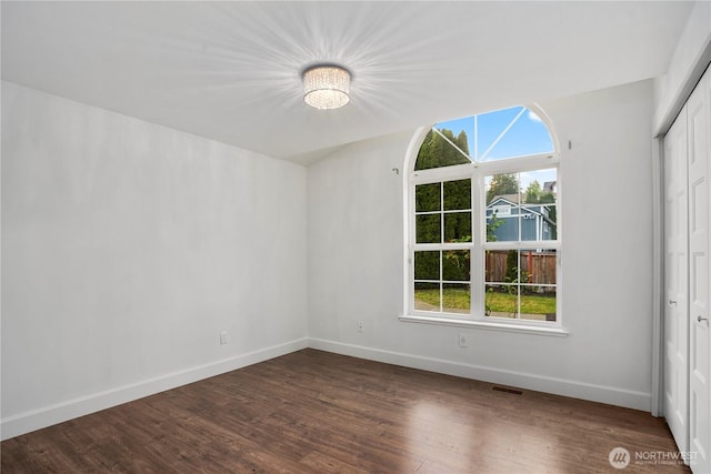 1420 Mitchell Rd, Lake Stevens, WA 98258 - empty room with baseboards, dark wood finished floors, and a chandelier