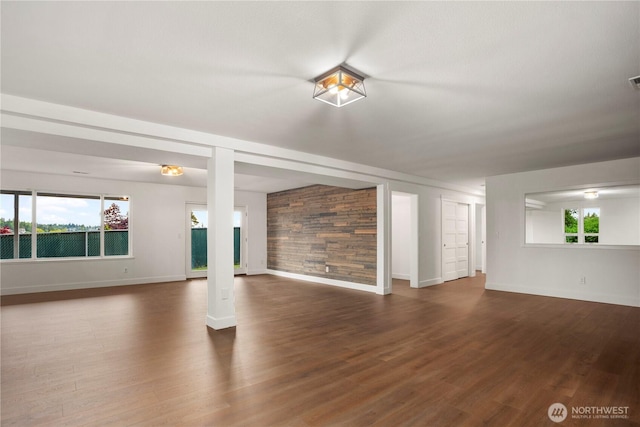 1420 Mitchell Rd, Lake Stevens, WA 98258 - unfurnished living room featuring healthy amount of natural light, baseboards, and dark wood-style floors