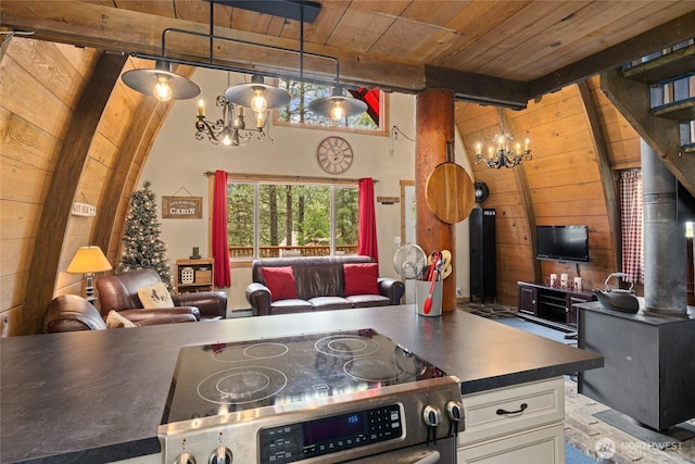 30 Tom Wright Rd, Ronald, WA 98940 - kitchen featuring a chandelier, electric stove, wooden ceiling, open floor plan, and wooden walls