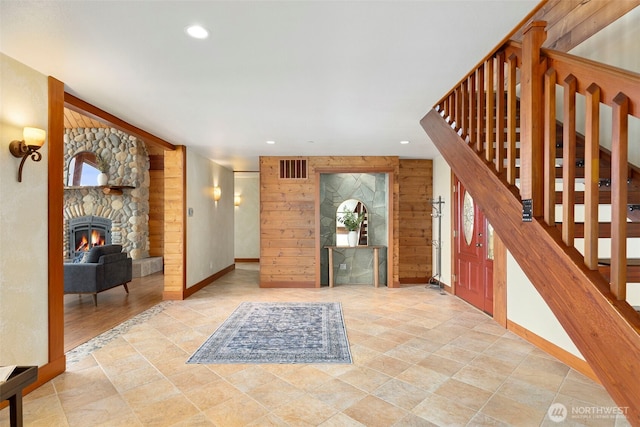790 N Hamma Ridge Dr, Lilliwaup, WA 98555 - entrance foyer featuring a stone fireplace, recessed lighting, stairway, healthy amount of natural light, and baseboards