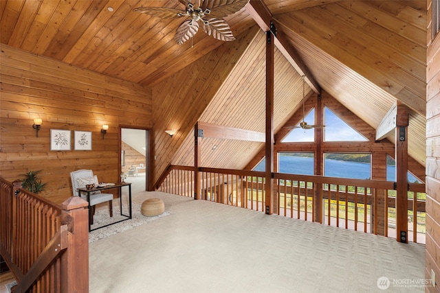 790 N Hamma Ridge Dr, Lilliwaup, WA 98555 - unfurnished room featuring a ceiling fan, a water view, carpet, wooden walls, and wooden ceiling