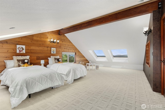 790 N Hamma Ridge Dr, Lilliwaup, WA 98555 - carpeted bedroom featuring a skylight and wood walls
