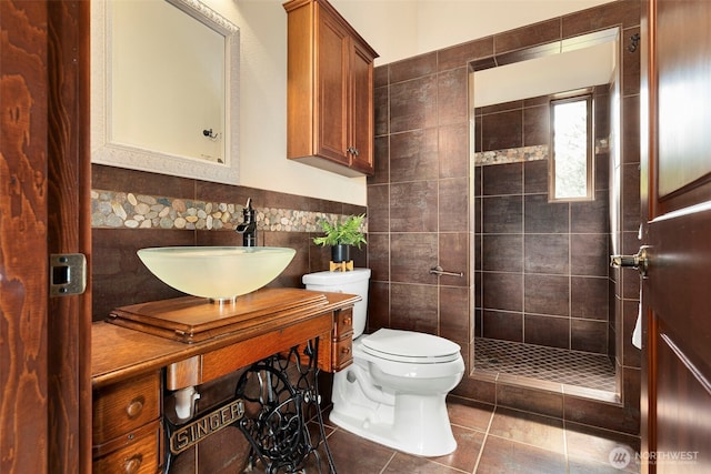 790 N Hamma Ridge Dr, Lilliwaup, WA 98555 - bathroom with tile walls, toilet, tile patterned flooring, tiled shower, and vanity