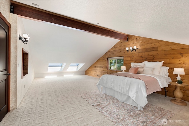 790 N Hamma Ridge Dr, Lilliwaup, WA 98555 - bedroom with wood walls, a skylight, carpet flooring, and a textured ceiling