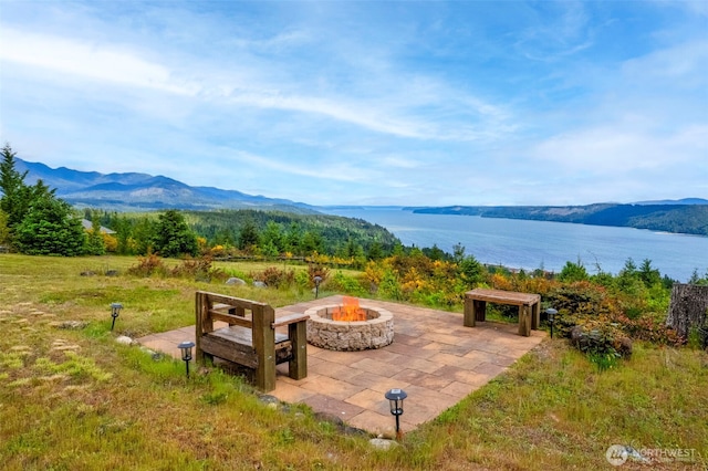 790 N Hamma Ridge Dr, Lilliwaup, WA 98555 - view of patio / terrace featuring an outdoor fire pit and a water and mountain view