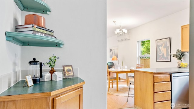 6508 NE Plum St, Suquamish, WA 98392 - kitchen with a chandelier, stainless steel dishwasher, light wood-style floors, light brown cabinets, and dark countertops