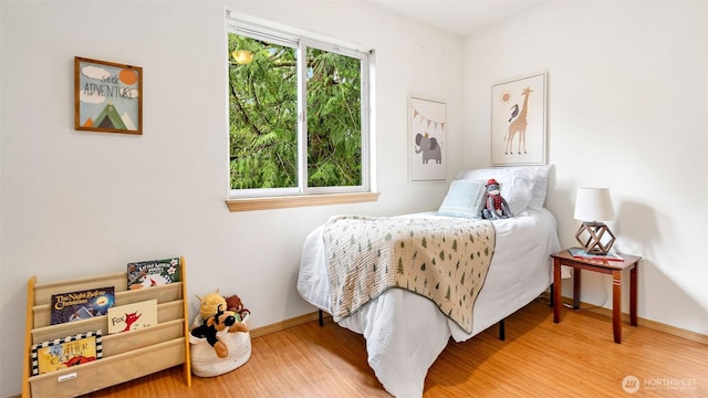 6508 NE Plum St, Suquamish, WA 98392 - bedroom with wood finished floors and baseboards