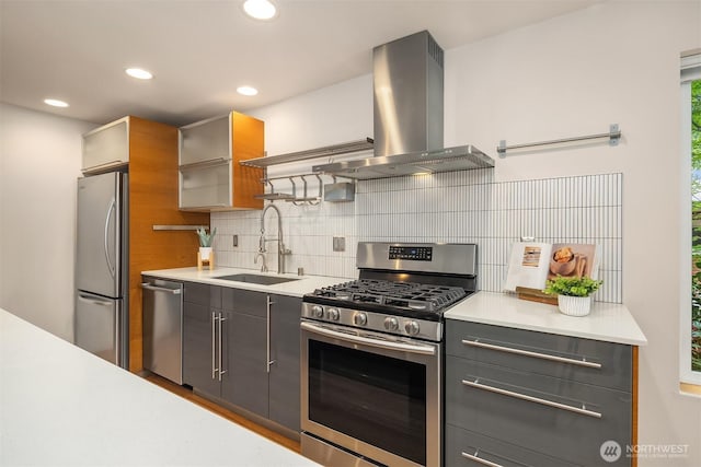 1833 27th Ave, Seattle, WA 98122 - kitchen featuring stainless steel appliances, island exhaust hood, a sink, light countertops, and recessed lighting