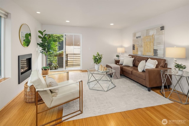 1833 27th Ave, Seattle, WA 98122 - living area with wood finished floors, recessed lighting, and a lit fireplace