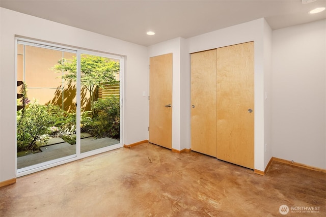 1833 27th Ave, Seattle, WA 98122 - unfurnished bedroom featuring baseboards, access to exterior, a closet, recessed lighting, and concrete floors
