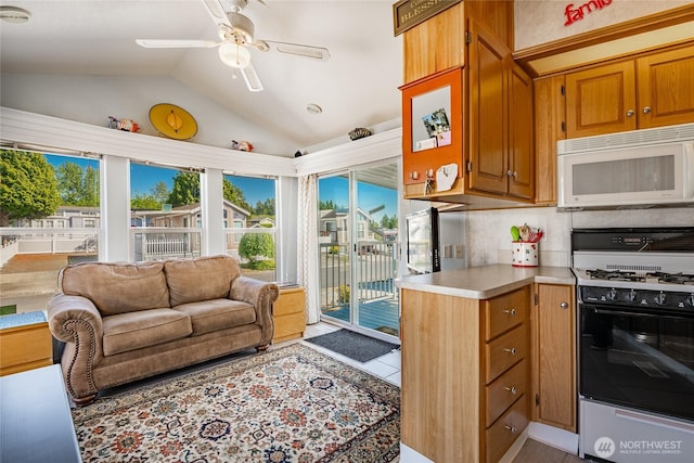 4751 Birch Bay Lynden Rd Unit 51, Blaine, WA 98230 - kitchen with white appliances, lofted ceiling, light countertops, a ceiling fan, and brown cabinetry