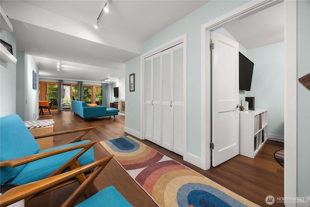 1524 NE 140th Unit D2, Seattle, WA 98125 - living area featuring wood finished floors, rail lighting, and baseboards