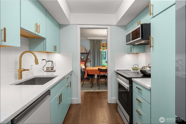 1524 NE 140th Unit D2, Seattle, WA 98125 - kitchen featuring range with electric cooktop, dishwashing machine, a sink, stainless steel microwave, and dark wood-style floors
