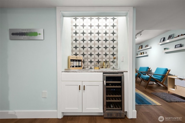 1524 NE 140th Unit D2, Seattle, WA 98125 - indoor wet bar featuring beverage cooler, dark wood-style flooring, and baseboards
