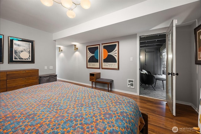 1524 NE 140th Unit D2, Seattle, WA 98125 - bedroom with wood finished floors, baseboards, heating unit, and a closet