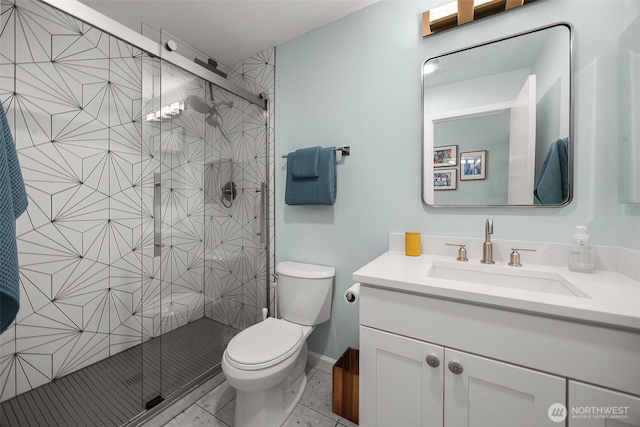 1524 NE 140th Unit D2, Seattle, WA 98125 - bathroom featuring vanity, toilet, a stall shower, and baseboards