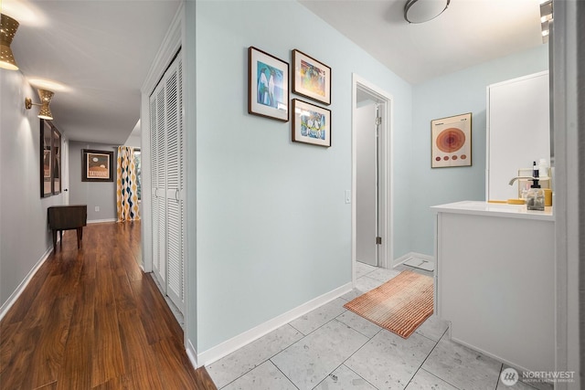 1524 NE 140th Unit D2, Seattle, WA 98125 - hallway with baseboards and a sink