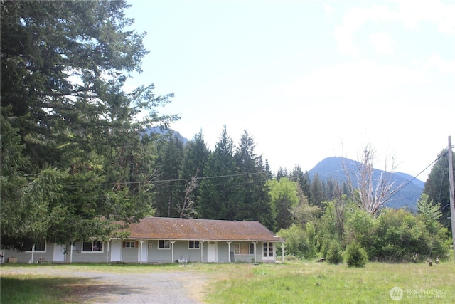 12597 US Highway 12, Randle, WA 98377 - ranch-style home featuring driveway, a mountain view, and a wooded view