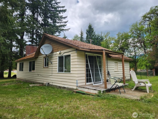 12597 US Highway 12, Randle, WA 98377 - rear view of house with a chimney and a wooden deck
