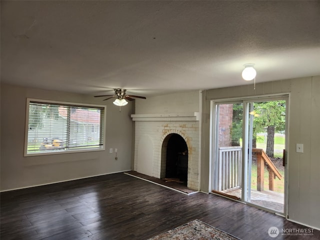12597 US Highway 12, Randle, WA 98377 - unfurnished living room featuring healthy amount of natural light, wood finished floors, and ceiling fan