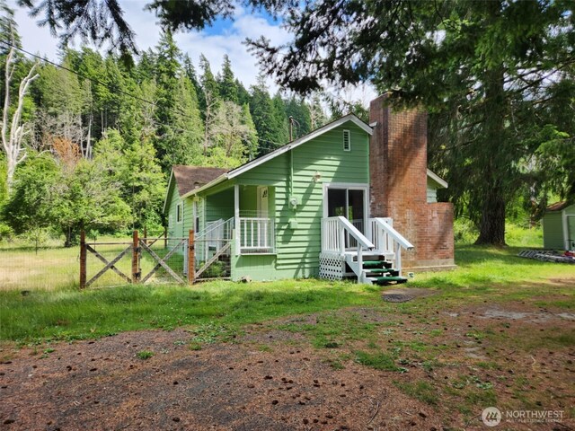 12597 US Highway 12, Randle, WA 98377 - view of front facade featuring a chimney and a forest view