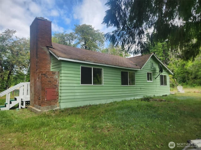 12597 US Highway 12, Randle, WA 98377 - view of side of home featuring a chimney and a yard