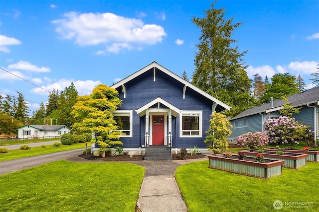 2404 Old Lakeway Dr, Bellingham, WA 98229 - view of front of property with a front lawn and a vegetable garden