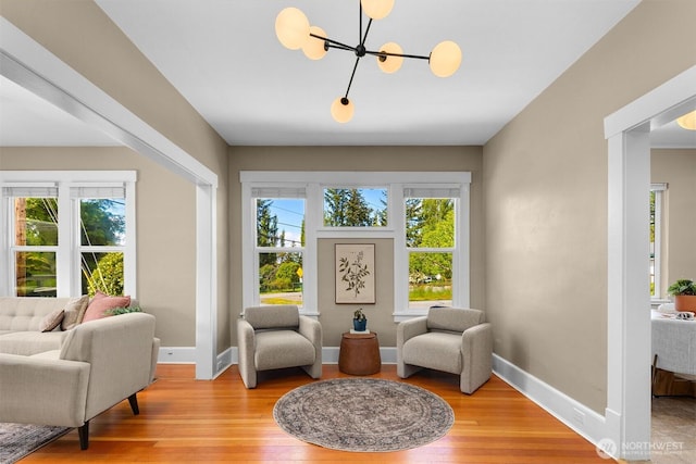 2404 Old Lakeway Dr, Bellingham, WA 98229 - sitting room with light wood-style floors, a chandelier, and baseboards