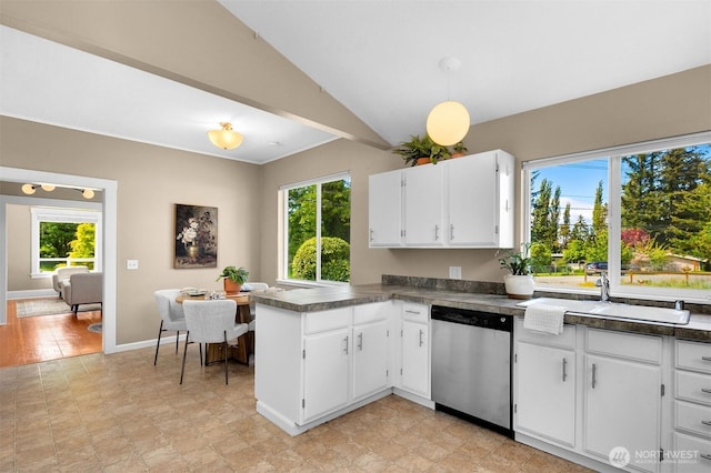 2404 Old Lakeway Dr, Bellingham, WA 98229 - kitchen with dishwasher, vaulted ceiling, dark countertops, a peninsula, and white cabinetry
