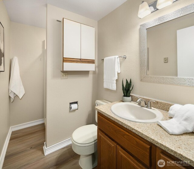 3716 Lake Washington Blvd SE Unit C, Bellevue, WA 98006 - bathroom featuring wood finished floors, toilet, baseboards, and vanity