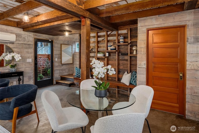 4256 S Spencer St Unit 2, Seattle, WA 98118 - dining space with wood walls, finished concrete flooring, a wall mounted air conditioner, wooden ceiling with exposed beams, and a relaxing sauna